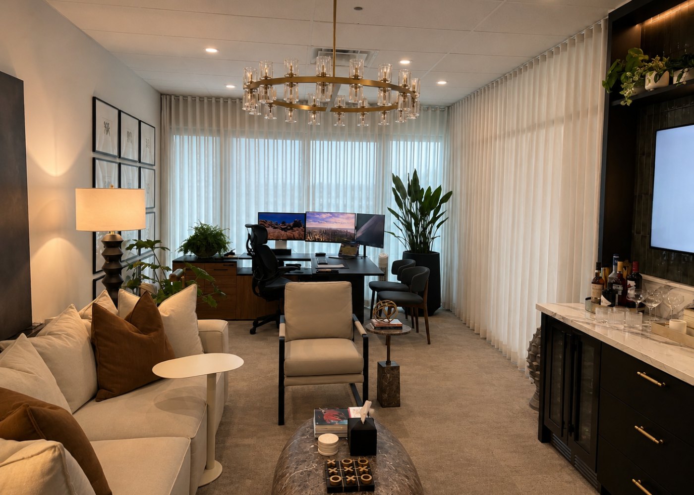 A home office with wall-to-wall sheer curtains